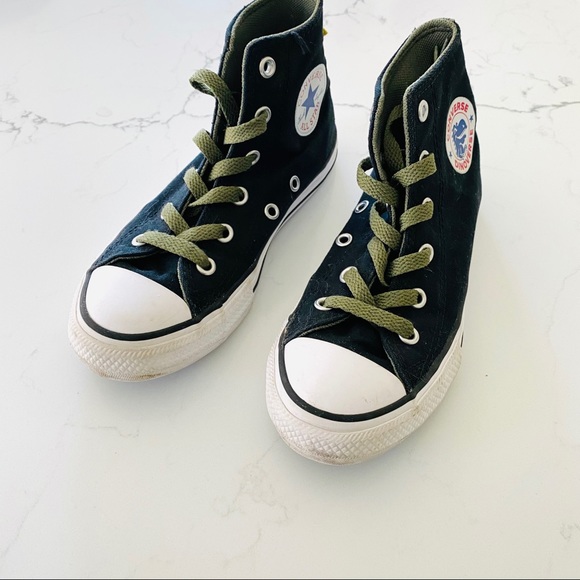 converse dinosaur spikes